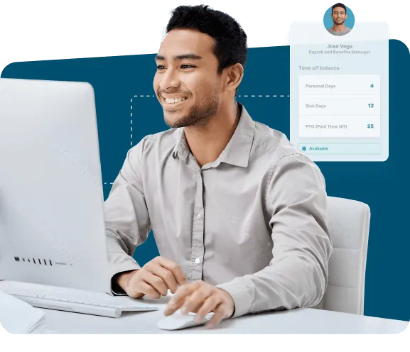 Smiling man works at a desktop computer with a digital team attendance dashboard.